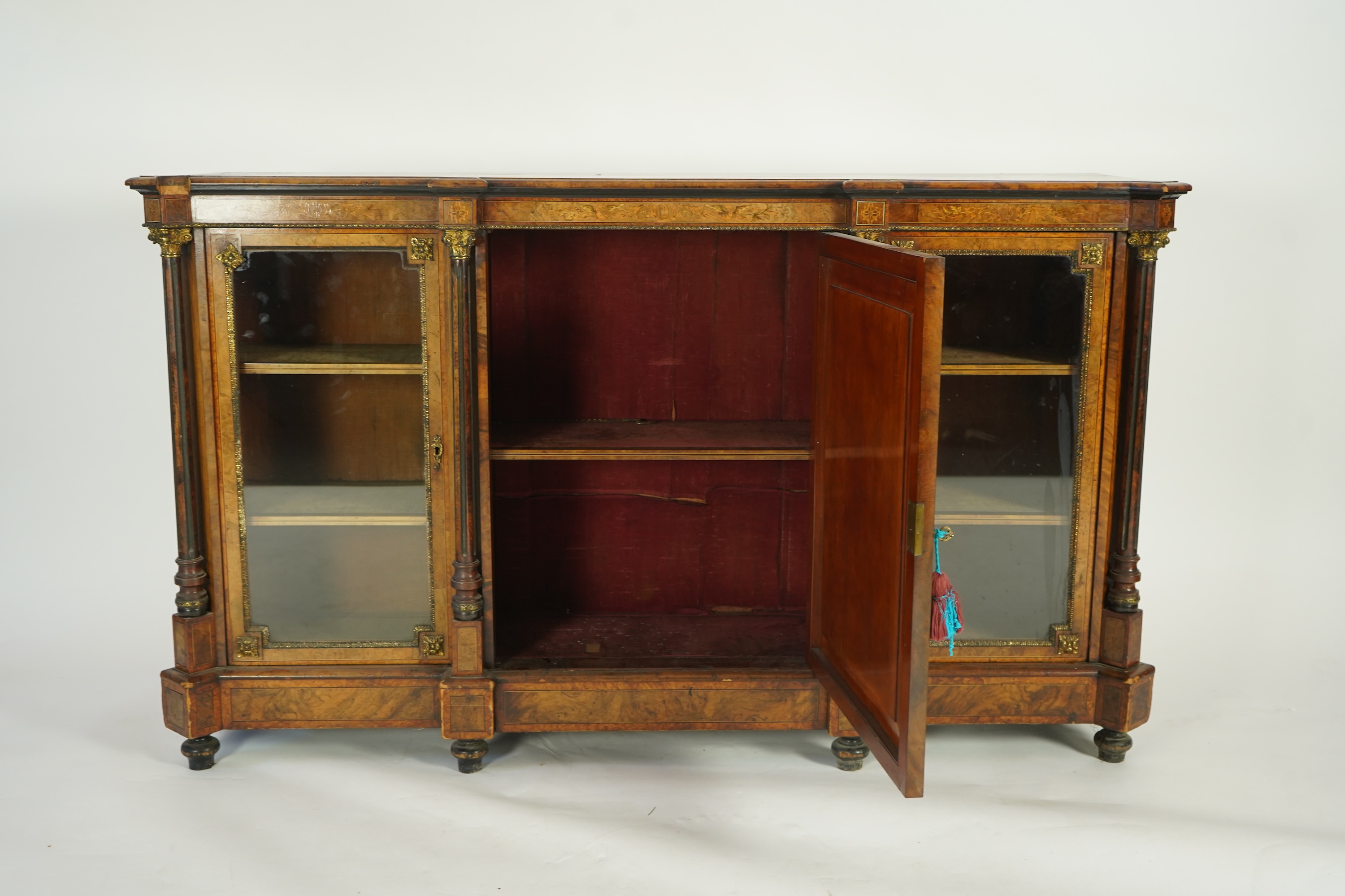 A Victorian birds eye maple banded, gilt metal mounted figured walnut side cabinet